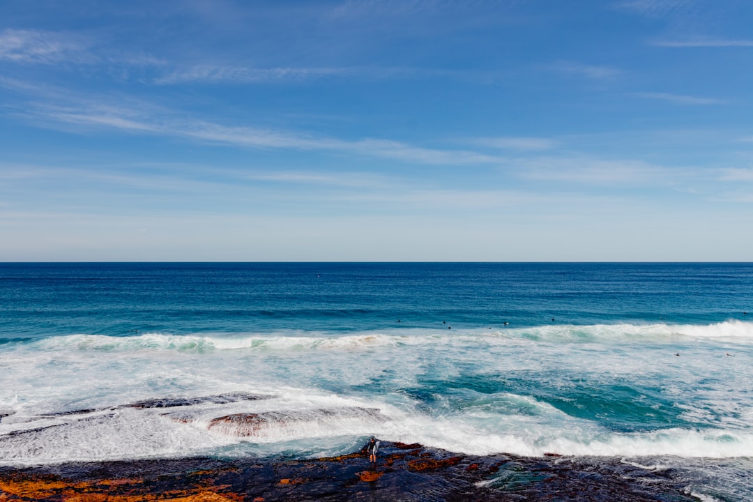 Pacific water breaking over a flat rock ledge near Sydney's eastern coastline