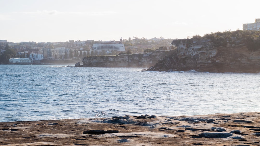 Sydney eastern suburbs coastline near Clovelly with ocean, cliffs and buildings in soft light